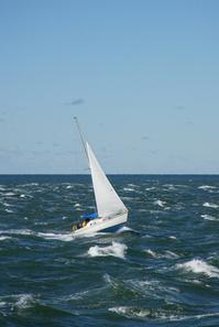 Small_sailboat_30_feet_sailing_in_the_rough_windy_Aegean_Sea.jpg